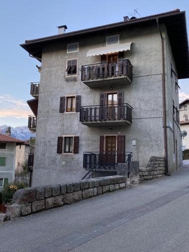 a building with balconies on the side of it at Madruzzo e Natura del Garda B&B in Lasino