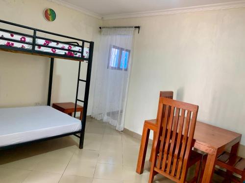 Ένα ή περισσότερα κρεβάτια σε δωμάτιο στο Amani Apartment
