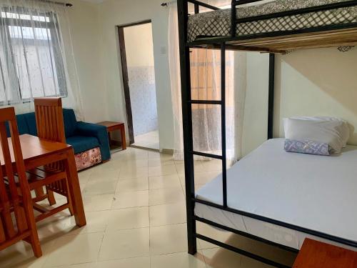 Ένα ή περισσότερα κρεβάτια σε δωμάτιο στο Amani Apartment