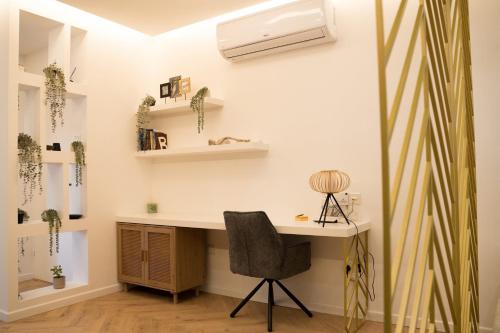 a home office with a desk and a chair at Delightful 1st Floor Xanthippis Apartment in Strovolos