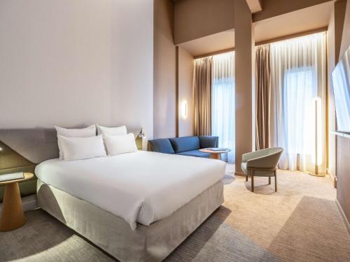 Postel nebo postele na pokoji v ubytování Novotel Brugge Centrum