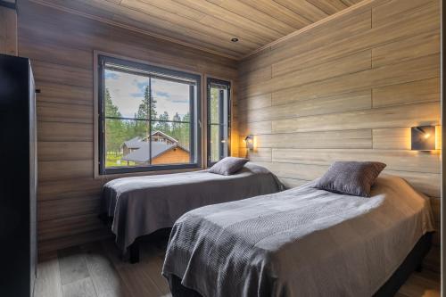 Ένα ή περισσότερα κρεβάτια σε δωμάτιο στο Villa Hankielämä B