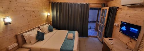 TV a/nebo společenská místnost v ubytování Sand Tent Beach Resort Patnem