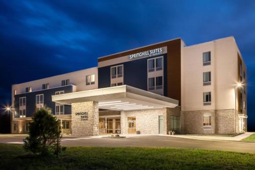 a building with a sign that reads sheridan plus at SpringHill Suites by Marriott Ames in Ames