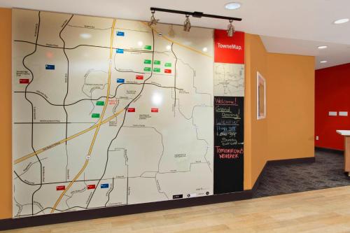 a large map on a wall in a room at TownePlace Suites by Marriott Dallas McKinney in McKinney