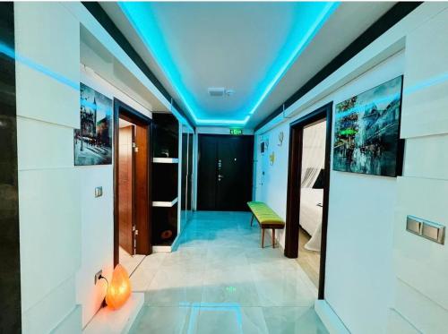 a room with a blue ceiling with a bench at Ella Willa Suite House Butik Otel in Gure