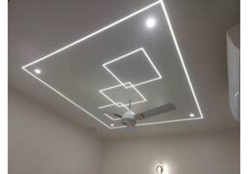 a recessed ceiling with a ceiling fan in a room at Raghav Vilas - Essence of Kashi in Varanasi