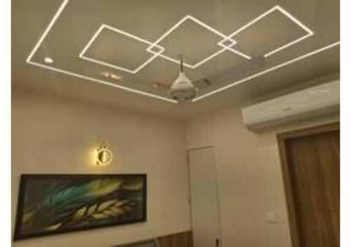 a ceiling in a room with a painting on the wall at Raghav Vilas - Essence of Kashi in Varanasi