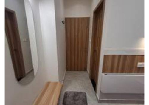 a small bathroom with a tub and a mirror at Raghav Vilas - Essence of Kashi in Varanasi