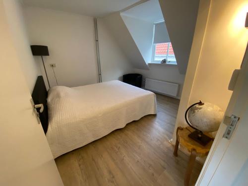 เตียงในห้องที่ Hartje Historisch Middelburg