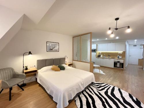 a bedroom with a bed and a desk and a chair at Prime Stays at 92 Antim I Street in Sofia