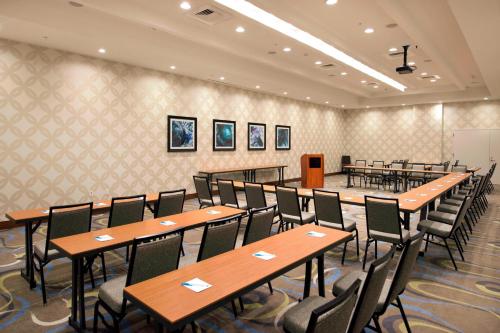 a conference room with tables and chairs in it at SpringHill Suites by Marriott Wilmington Wrightsville Beach in Wilmington