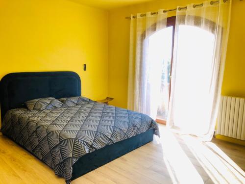 Postel nebo postele na pokoji v ubytování Casa Scaglione - camara giallu