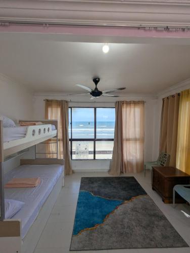 Postel nebo postele na pokoji v ubytování Pandak Inn - Your Beach Retreat