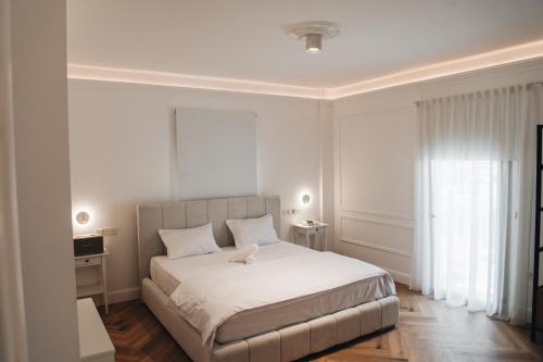 Ένα ή περισσότερα κρεβάτια σε δωμάτιο στο Hyperion Boutique Villa