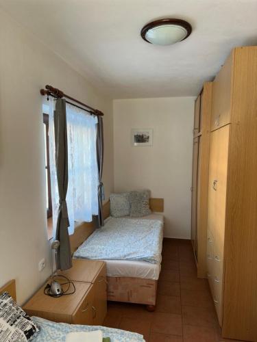 a bedroom with two beds and a window at Slunečná Lada in Borová Lada