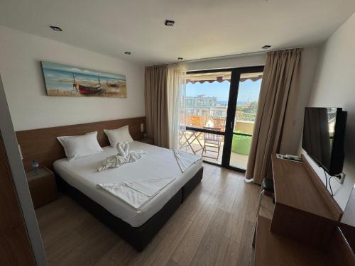 Postel nebo postele na pokoji v ubytování Family Hotel Serenity Palace