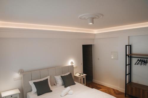 Ένα ή περισσότερα κρεβάτια σε δωμάτιο στο Hyperion Boutique Villa