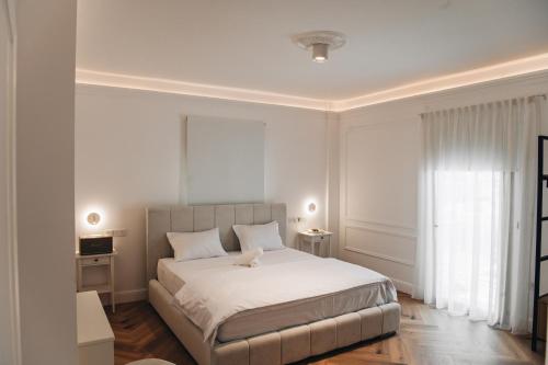 Ένα ή περισσότερα κρεβάτια σε δωμάτιο στο Hyperion Boutique Villa