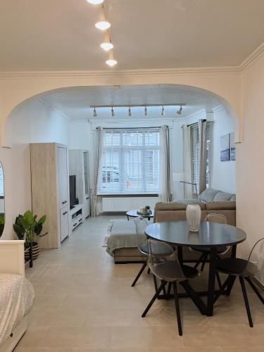 a living room with a couch and a table at B Chez Hamdi in Knokke-Heist
