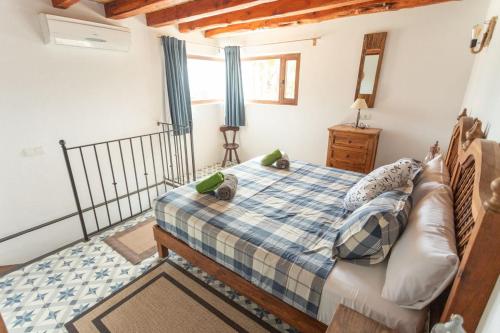 Ένα ή περισσότερα κρεβάτια σε δωμάτιο στο Villa Es Cubells 439