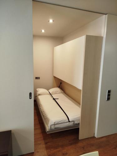 a small room with a bed inside of it at Cal Miquel in Alpens