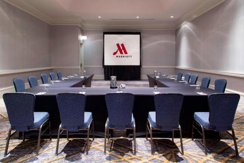 a conference room with a long table and chairs at Franklin Marriott Cool Springs in Franklin