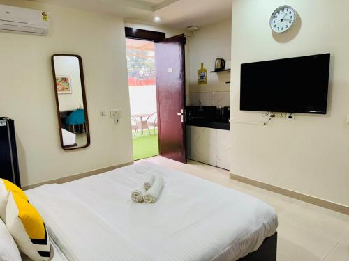 Televisyen dan/atau pusat hiburan di BluO Stays - DLF CyberCity Gurgaon