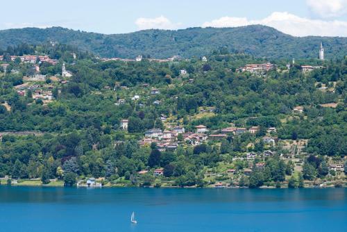 an aerial view of a town on the shore of a lake at Villa Ferrari, Le Betulle in San Maurizio dʼOpaglio