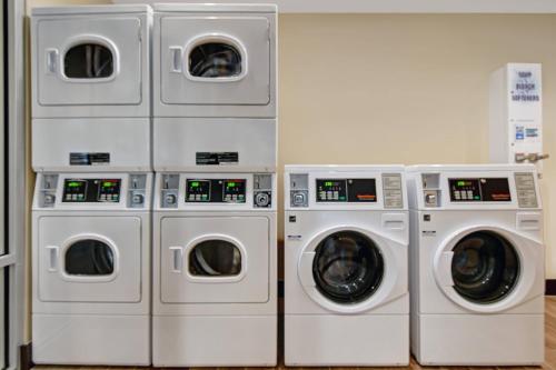 four washing machines and three washers in a room at TownePlace Suites By Marriott Lima in Lima