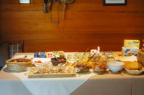 a table with food and other food items on it at Garni Cir in Santa Cristina in Val Gardena