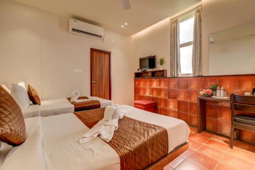 Posezení v ubytování Hotel J N Stay Mysore - 12 Minutes to Mysore Palace
