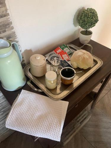a table with a tray of food on top of it at hospedaje la familia in Villa Lía