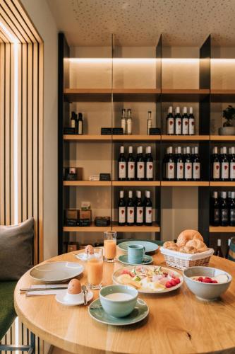 a table with plates of food on it at Weingut Radl in Klöch