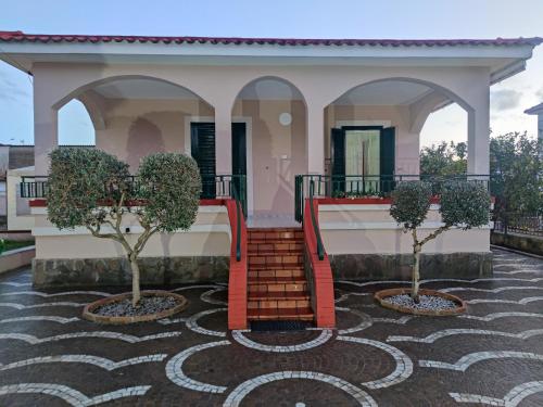 a house with two trees in front of it at Villa Carmine & Gina in Castel Volturno