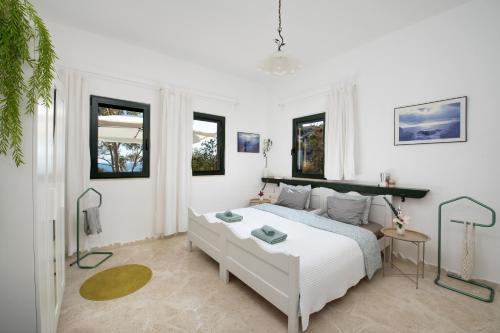 Ένα ή περισσότερα κρεβάτια σε δωμάτιο στο theCRETAN Apartments