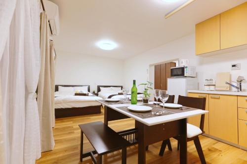 a kitchen and dining room with a table and chairs at Okubo 106-SJ0020 in Tokyo