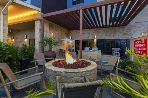 a fire pit in the middle of a patio at TownePlace Suites Dallas Plano/Richardson in Plano