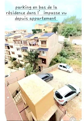 a picture of two cars parked in a parking lot at Magnifique appartement vue sur mer & baie d'Alger in Alger