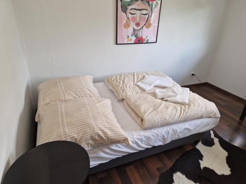 a unmade bed in a corner of a room at Comfortable and ideal for Frankfurt and surrounding area in Mörfelden-Walldorf