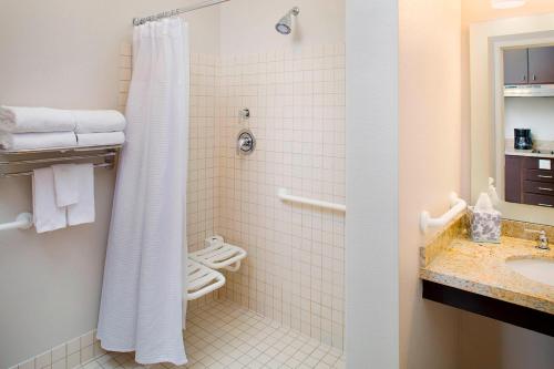 a bathroom with a shower and a sink at TownePlace Suites by Marriott Phoenix Goodyear in Goodyear