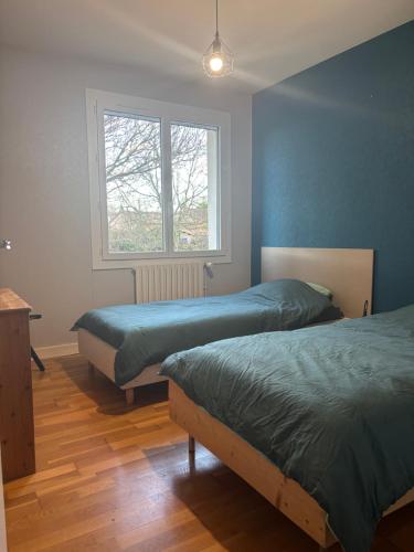 Postel nebo postele na pokoji v ubytování A proximité du futuroscope et des marais poitevin