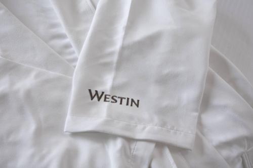 a white shirt with the word westin on it at The Westin Lake Las Vegas Resort & Spa in Las Vegas