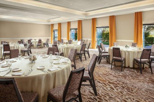 a banquet room with tables and chairs and windows at The Westin Lake Las Vegas Resort & Spa in Las Vegas