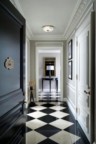 a hallway with a black and white checkered floor at The St. Regis New York in New York