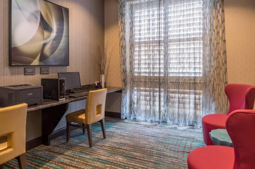 an office with a desk with a computer and chairs at Residence Inn Pittsburgh North Shore in Pittsburgh