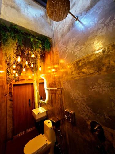 a bathroom with a toilet and a sink at Zen at Austin - Sleep 13 Pax-10 Min to Aeon Tebrau in Johor Bahru