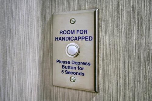 a door with a room for handicapped sign on it at Residence Inn by Marriott Stillwater in Stillwater