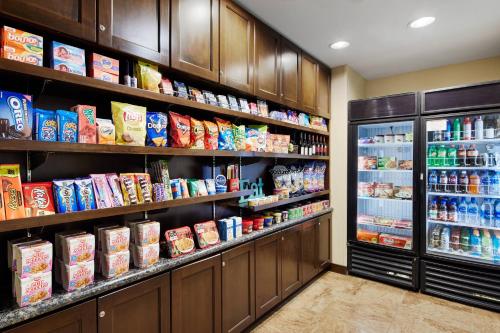 a grocery store aisle with shelves filled with food at TownePlace Suites by Marriott Midland in Midland