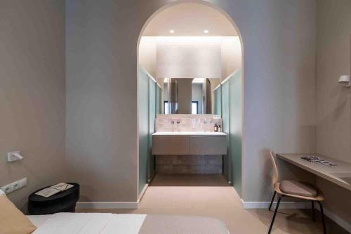 a bathroom with a sink and a mirror in a room at POINT BEACH beige in Valencia